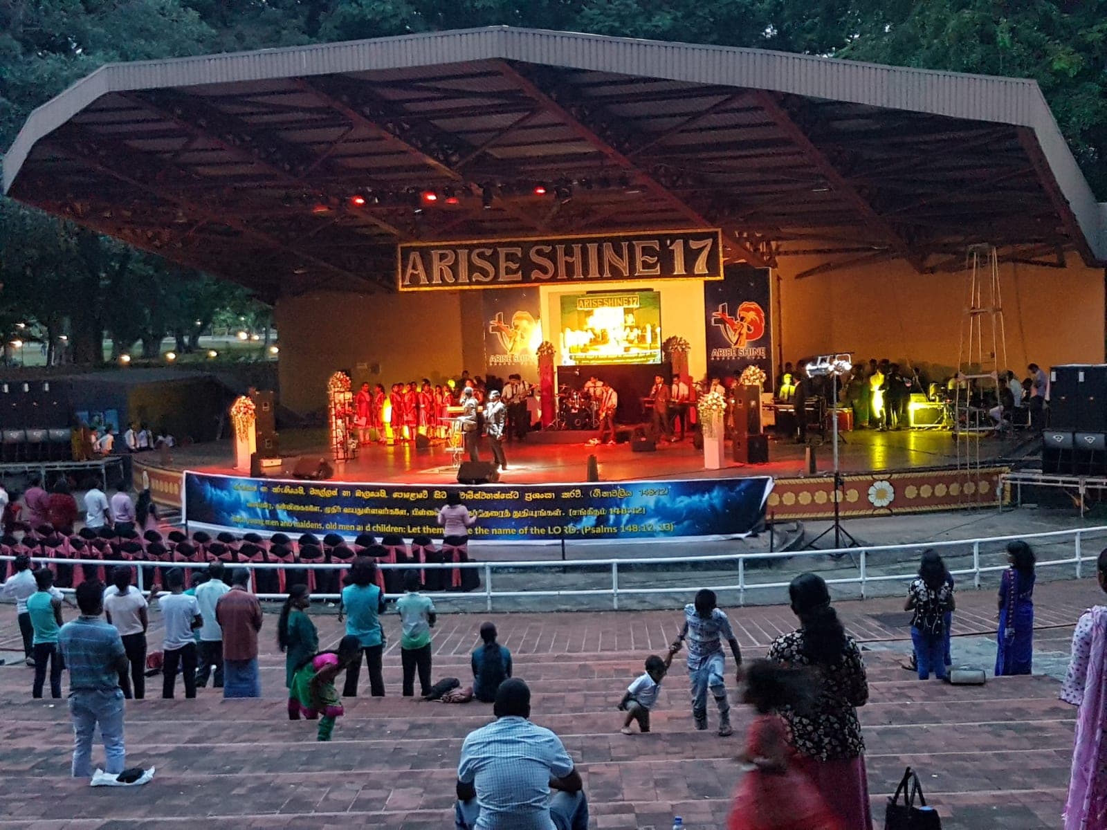 'Arise Shine' open-air event stage with a seated crowd