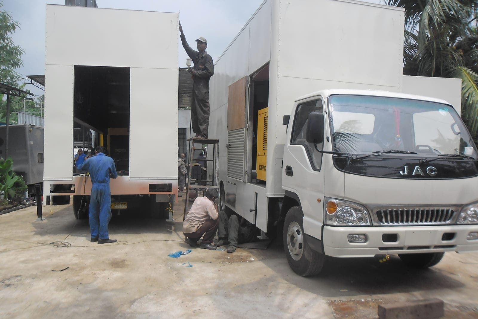 Fitting the screen on a mobile LED advertising truck in the workshop