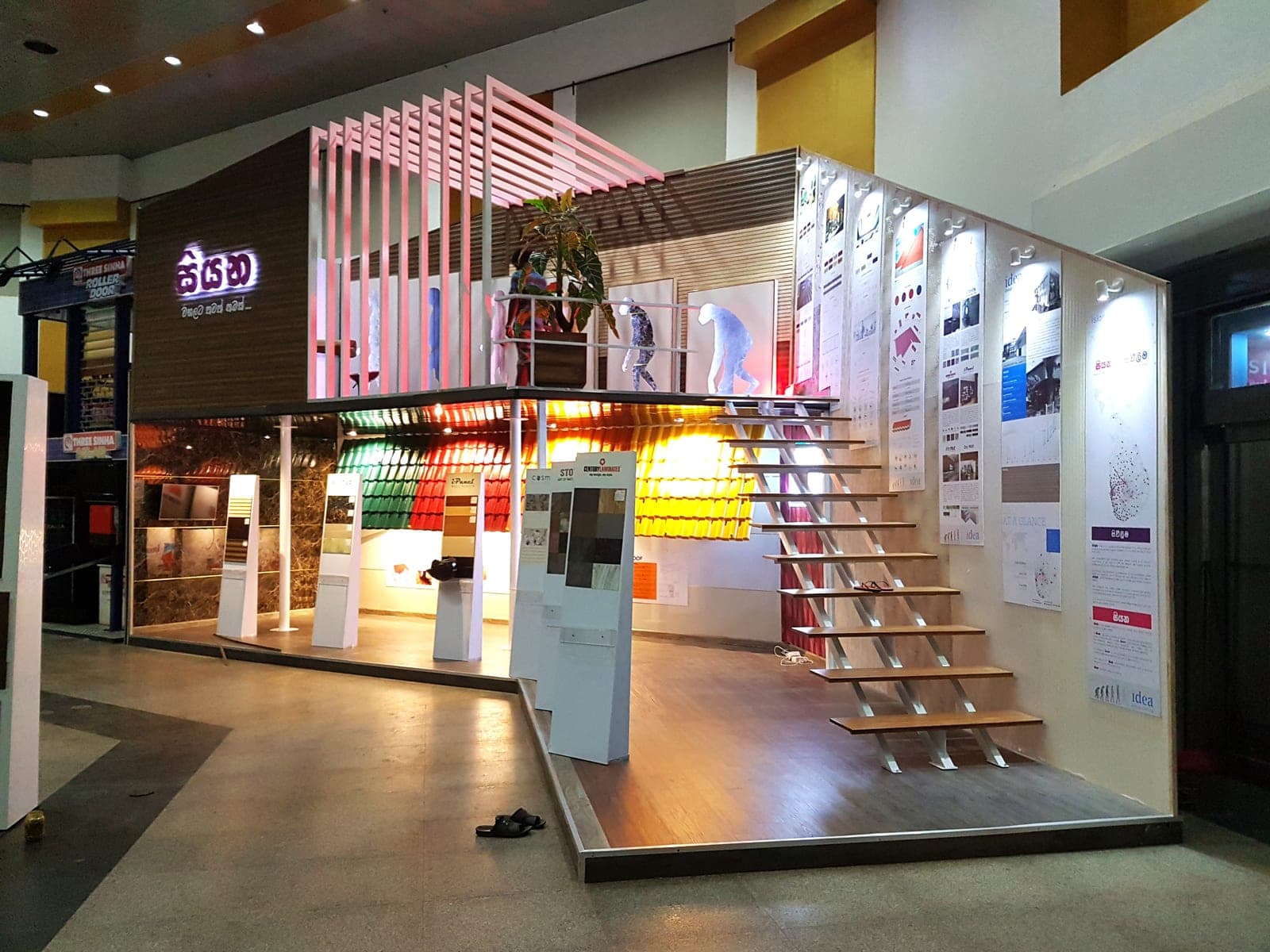 Backlit product-display stand with a staircase and colour-lit shelving