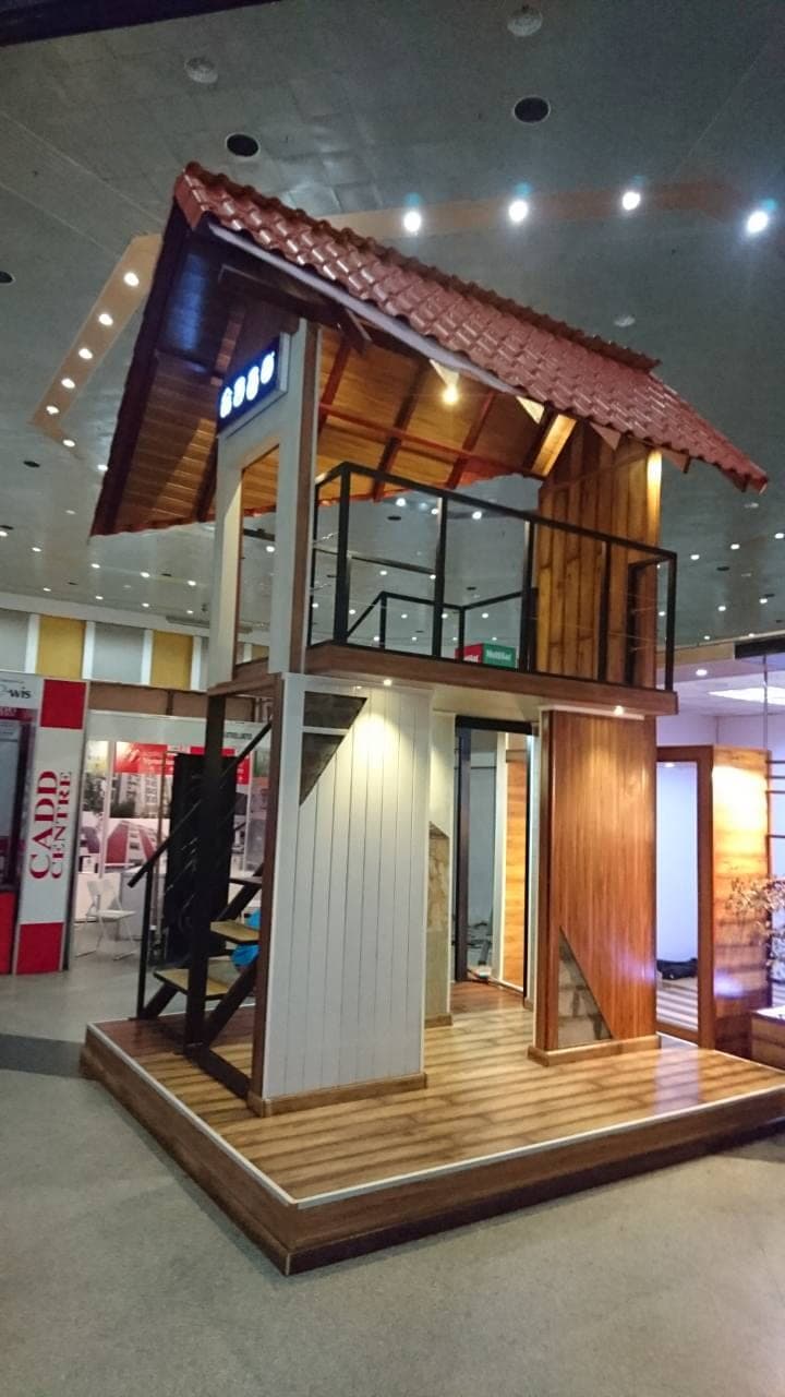 Two-storey timber-clad display pavilion with a clay roof-tile canopy
