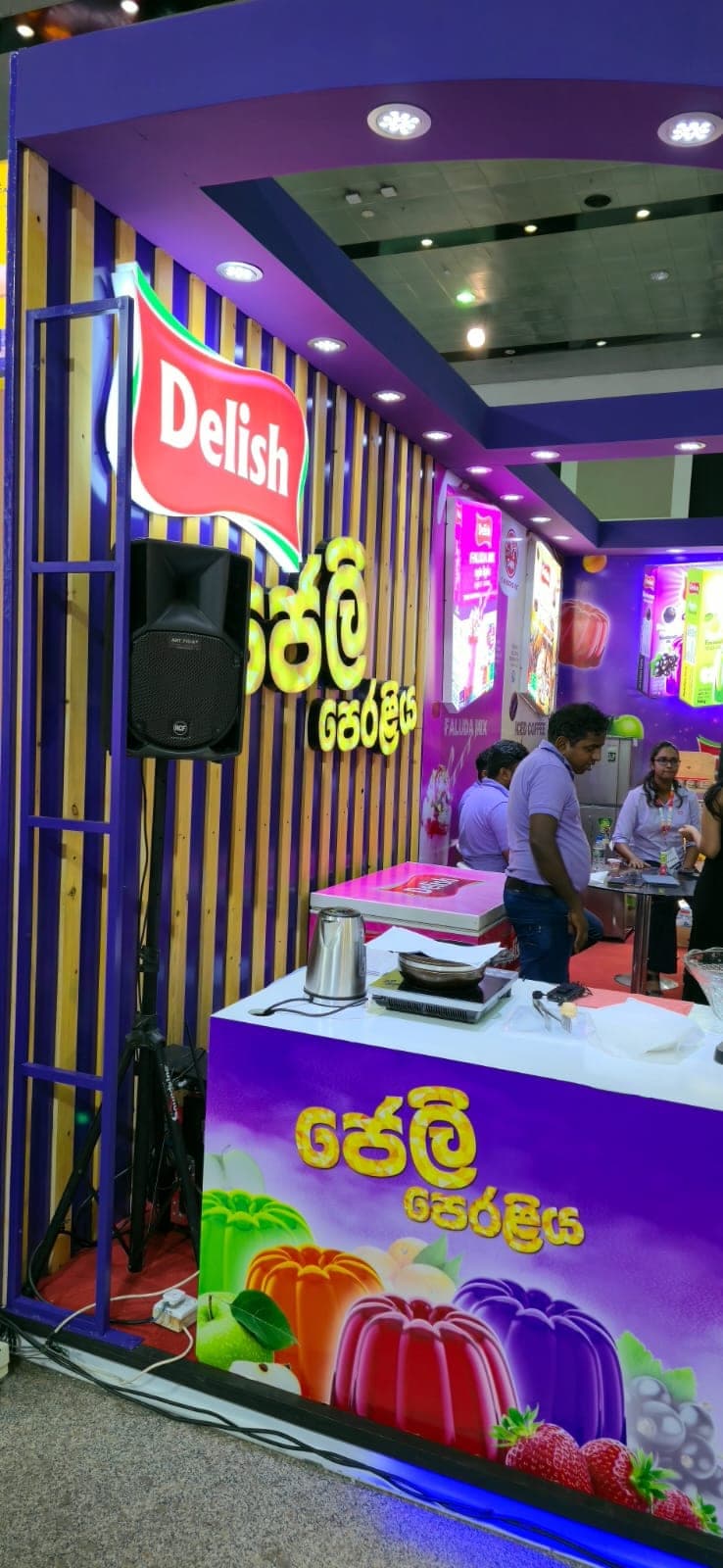 Delish jelly brand stall with an illuminated purple fascia and product graphics