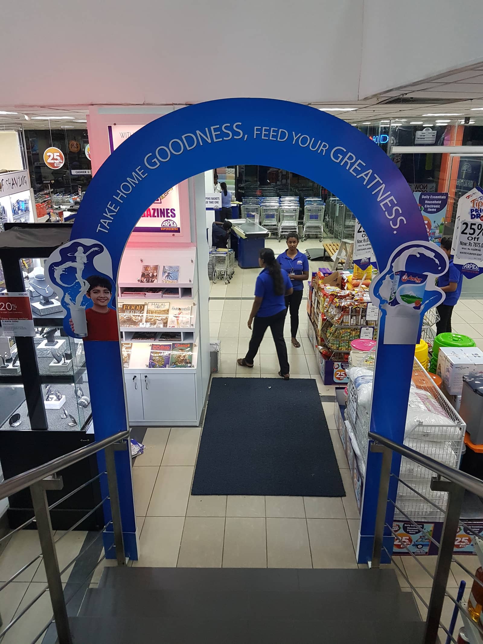 Branded supermarket entrance archway, 'Take home goodness'