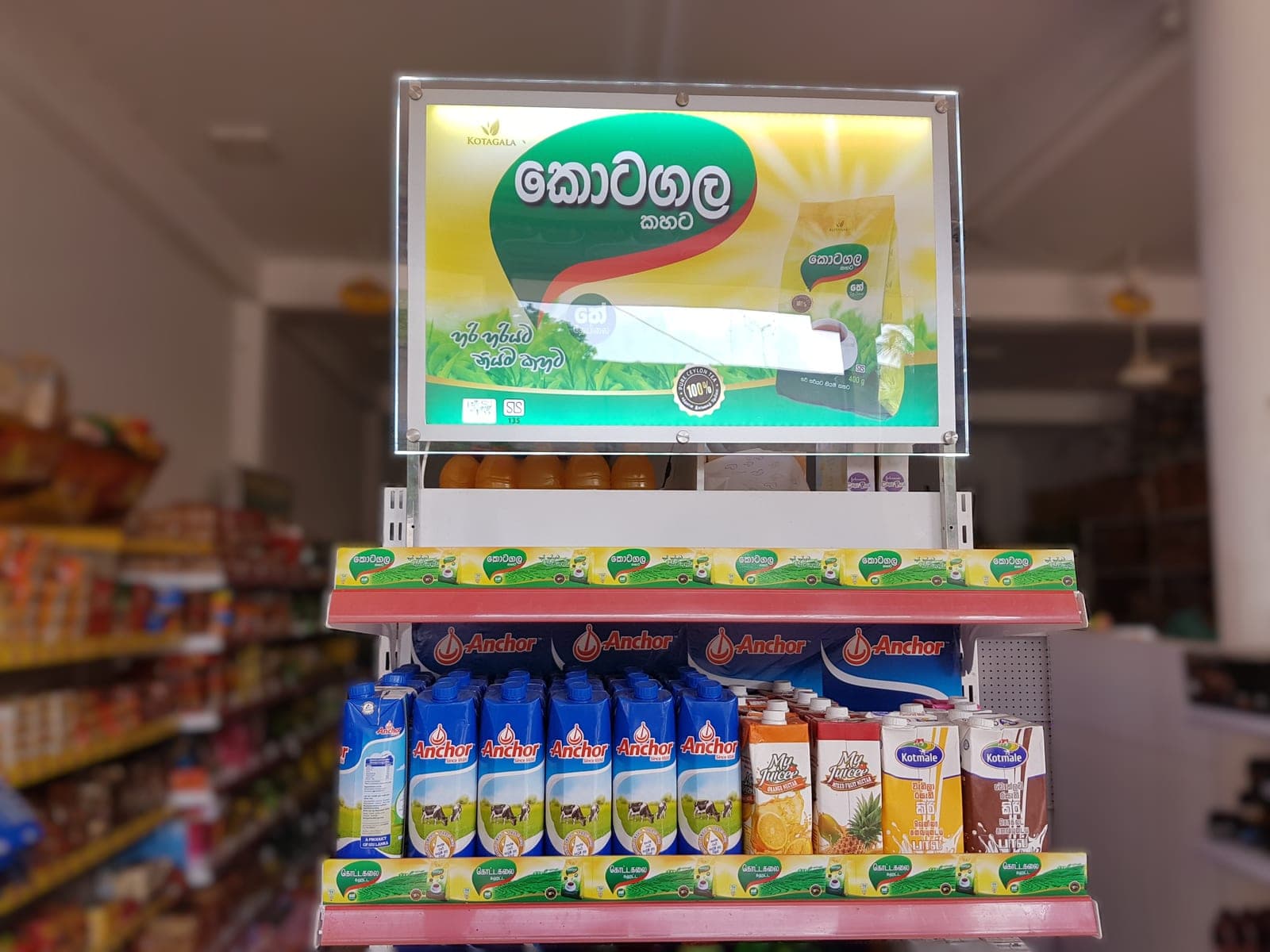 Kotagala tea branded product display stand with an illuminated header