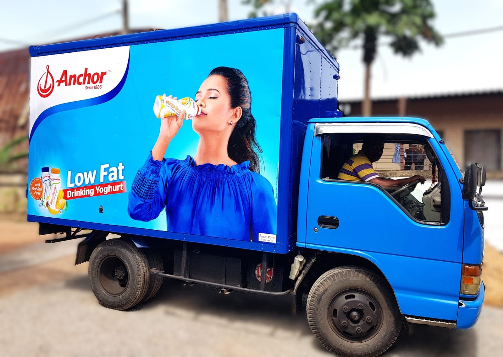 Anchor Low Fat drinking-yoghurt branded truck on the road, side view